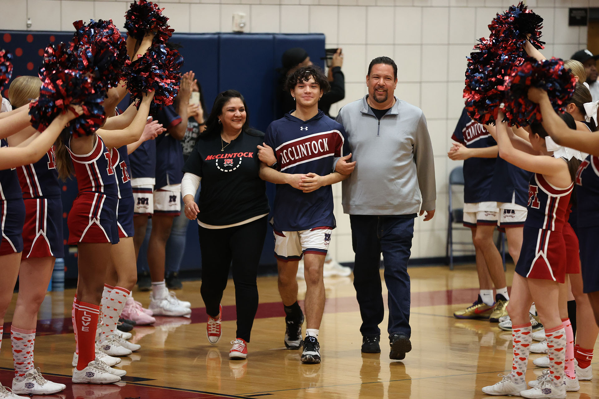 Joe and his parents during senior night