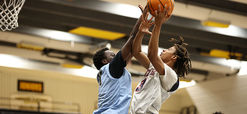 McClintock Chargers Basketball player going up for a shot