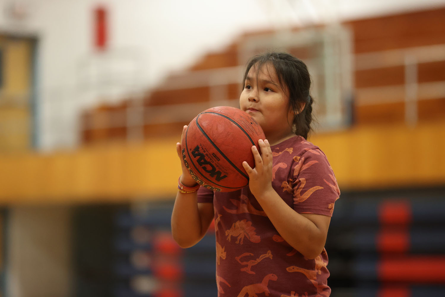 Young camper listening to coach