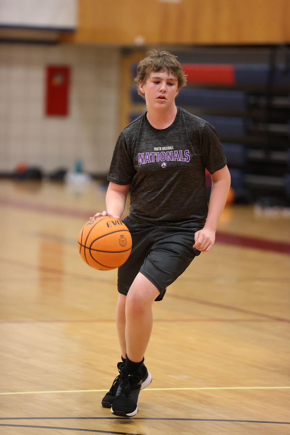 Camper dribbling down the lane