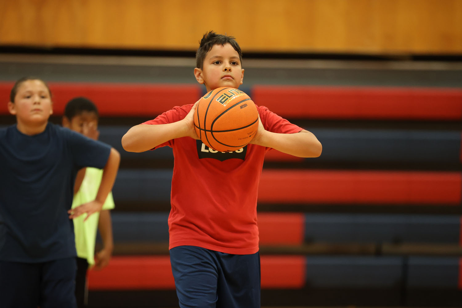 Young camper passing the ball in a drill