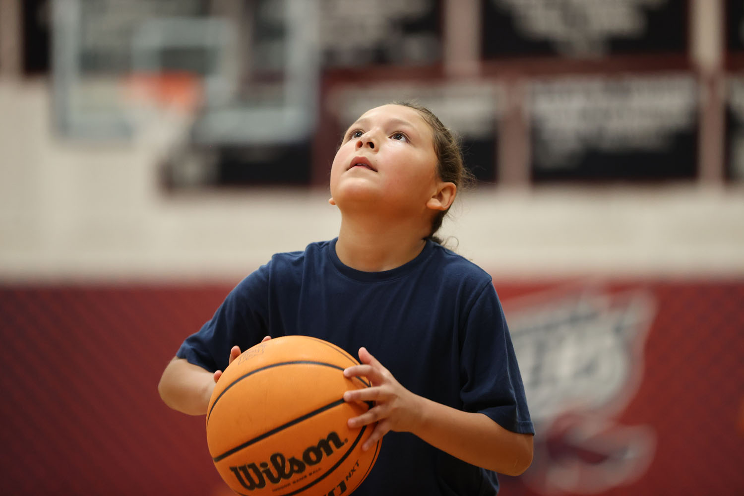 Young camper about to shoot the ball