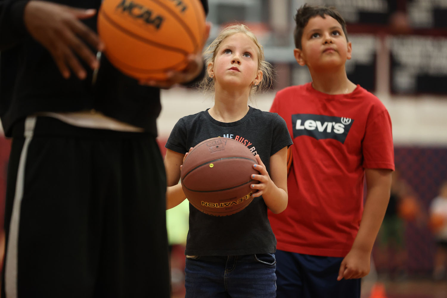 Young camper sizing up the hoop