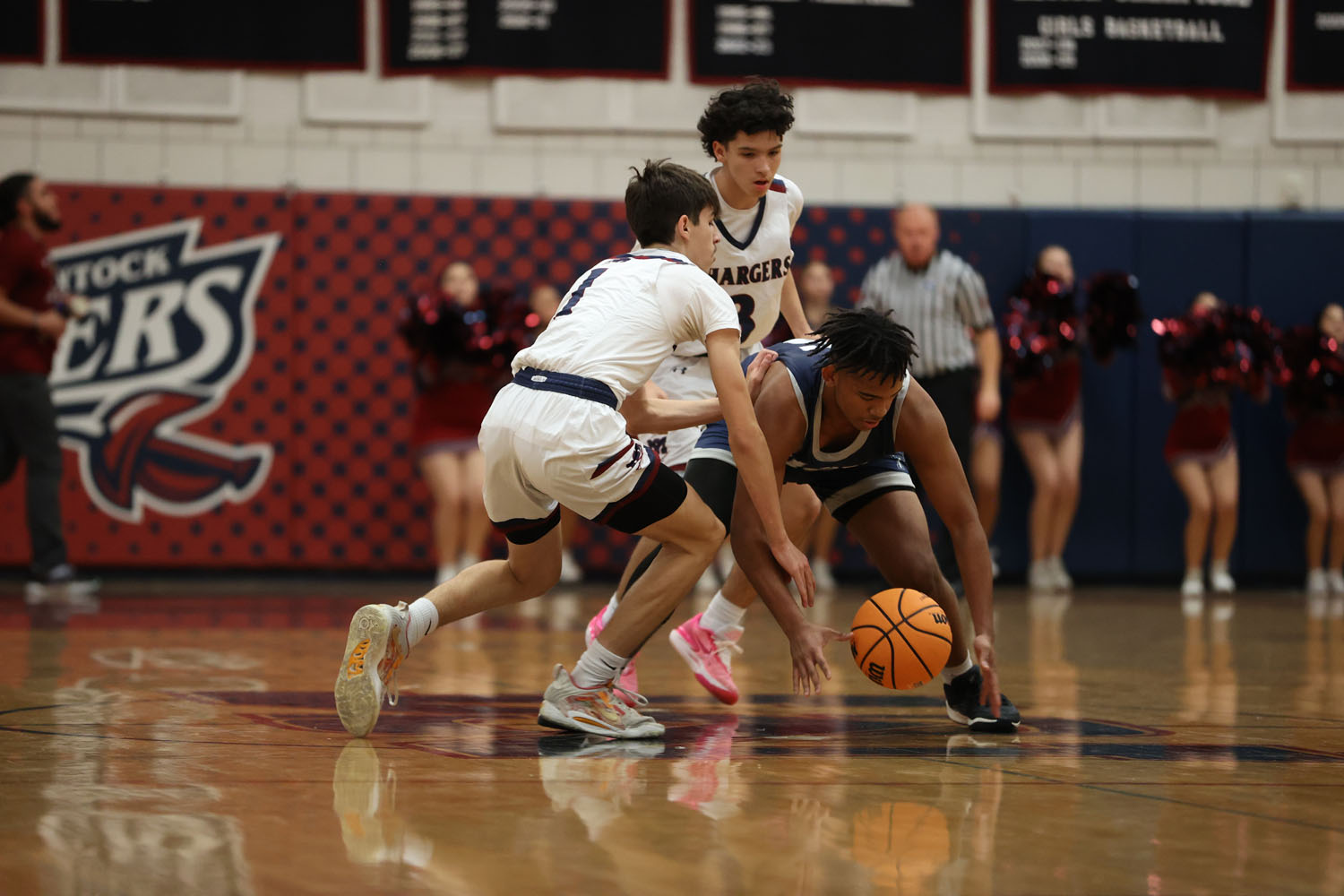 Players going after a loose ball